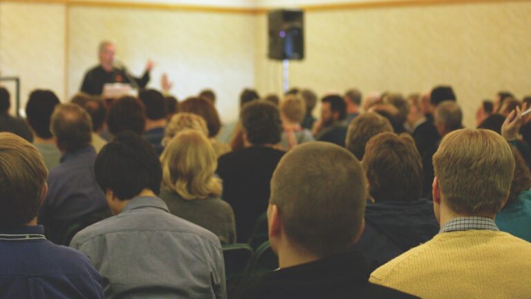 People asking questions in a meeting